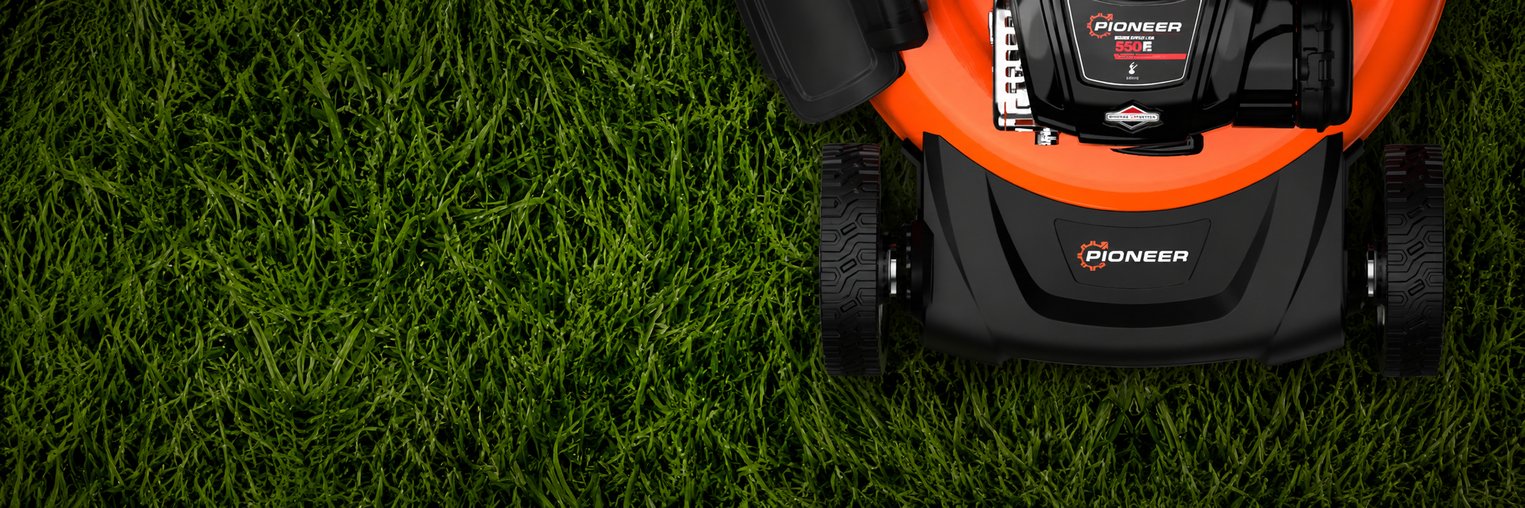 Mower on grass with Pioneer branding